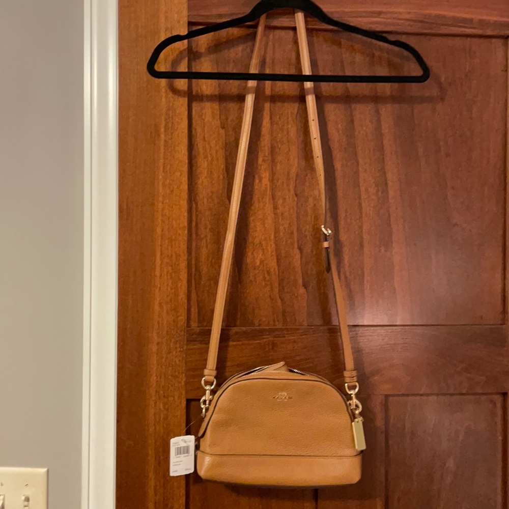 Brand new authentic chestnut coach crossbody bag.